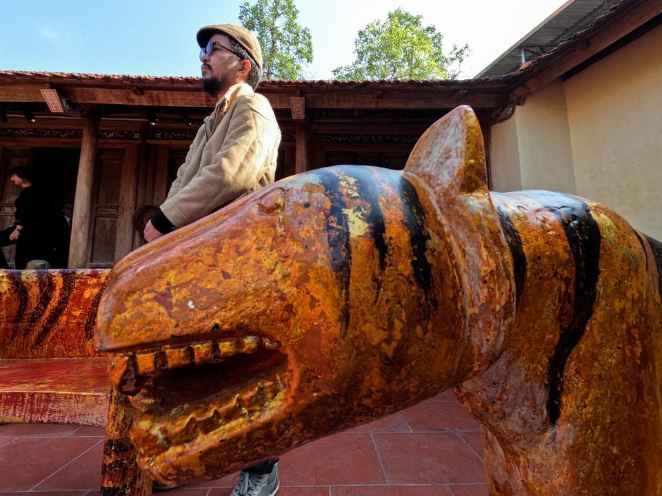 Vietnam artist marks Lunar New Year with hundreds of carved tigers