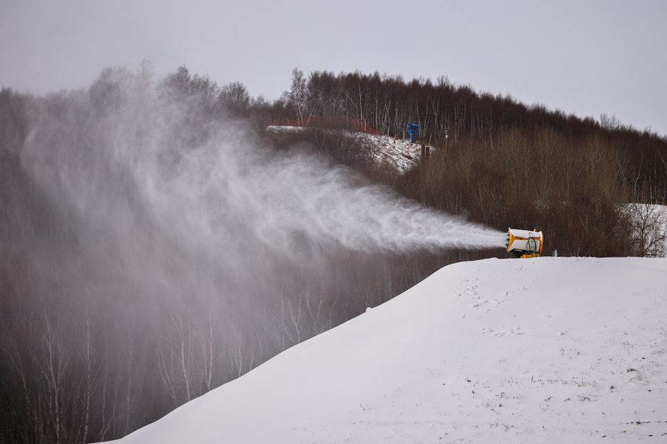 A TechnoAlpin snow gun sprays snow onto a slope at the Genting ski resort in Zhangjiakou, close to venues for the Winter Olympics Beijing 2022, Hebei province, China, November 20, 2021. Photo: Reuters