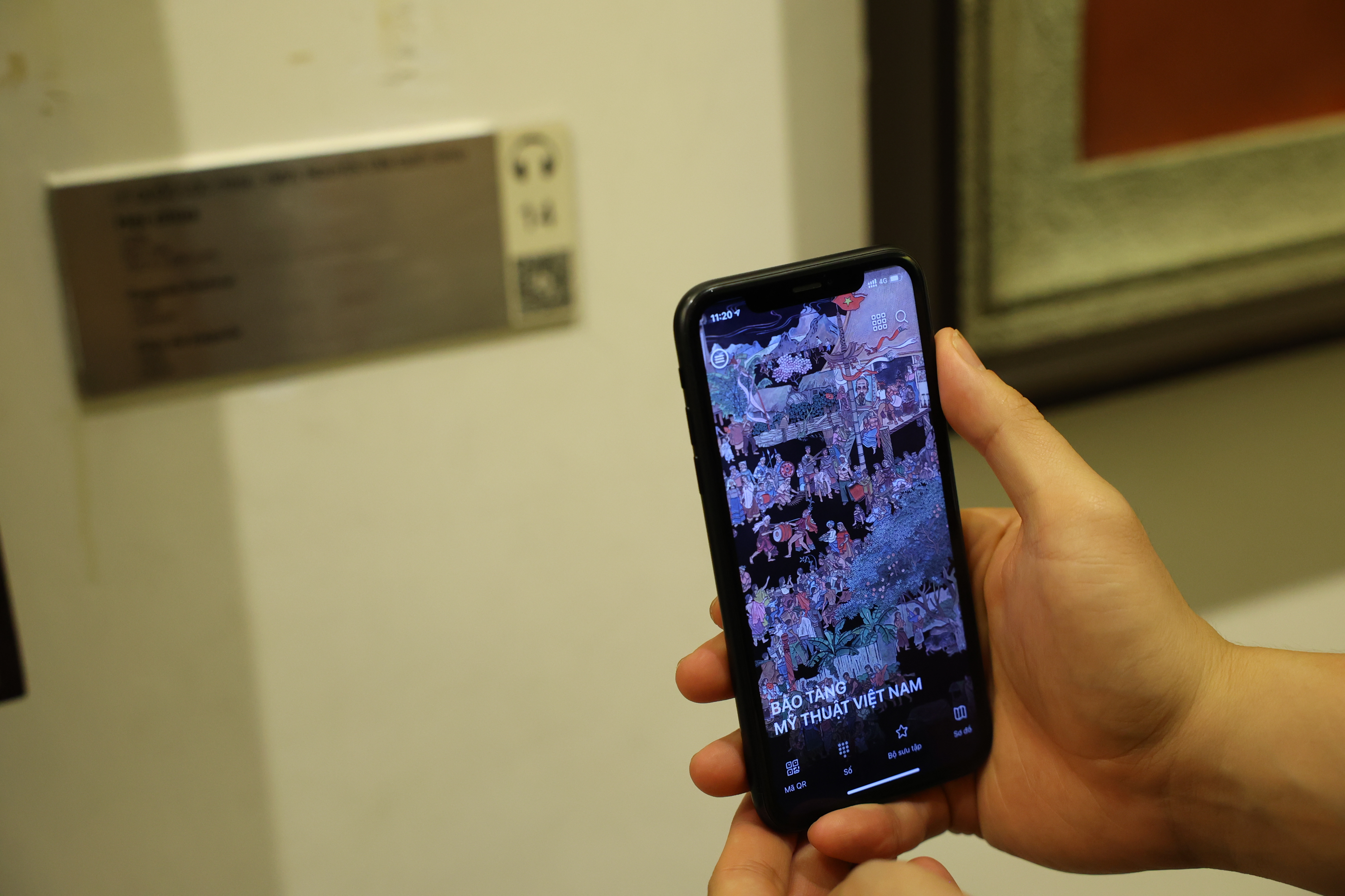 A visitor accesses iMuseum VFA, an application that supports users to find information about artworks displayed and stored at the Vietnam Fine Arts Museum in Hanoi, in this supplied photo.
