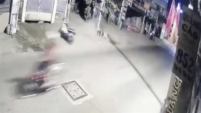 The victims crash into a utility pole on the side of the street in this still photo taken from CCTV footage.