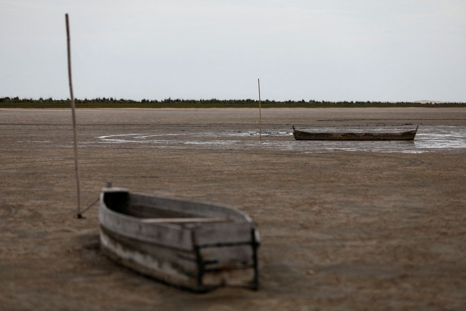 Boats are pictured at Lagoa do Peixe (Fish Lagoon) which was affected by drought in Tavares, Rio Grande do Sul state, Brazil February 5, 2022. Photo: Reuters