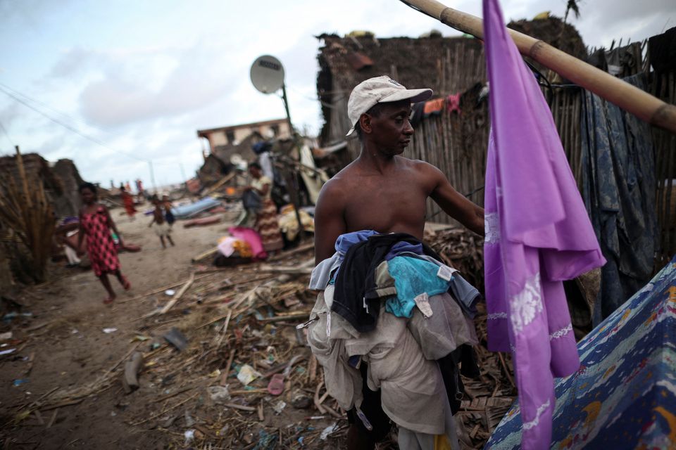 A local gathers his clothes, in the aftermath of Cyclone Batsirai, in the town of Mananjary, Madagascar, February 7, 2022. Photo: Reuters