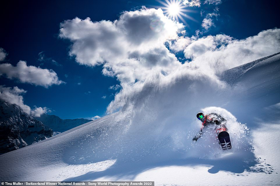 This dynamic picture shows the Swiss snowboarder Gian Simmen 'in his natural habitat' on Switzerland's Grindelwald First helps photographer Tinu Muller take the gold medal in the national award for Switzerland. Photo: Sony World Photography Awards 2022