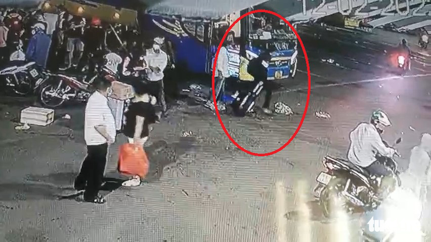 Nguyen Van Nghia arrives at Mien Dong (Eastern) Bus Station in Ho Chi Minh City, February 12, 2022 in the still photo taken from CCTV footage.