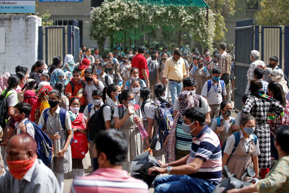 Students leave school after a majority of schools were reopened following their closure due to the coronavirus disease (COVID-19) pandemic, in Ahmedabad, India, February 24, 2022. Photo: Reuters
