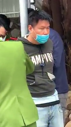 This screenshot captured from a video shows a man who was arrested following a failed attempt to rob a bank in Ha Long City, Quang Ninh Province, Vietnam. Handout via Tuoi Tre
