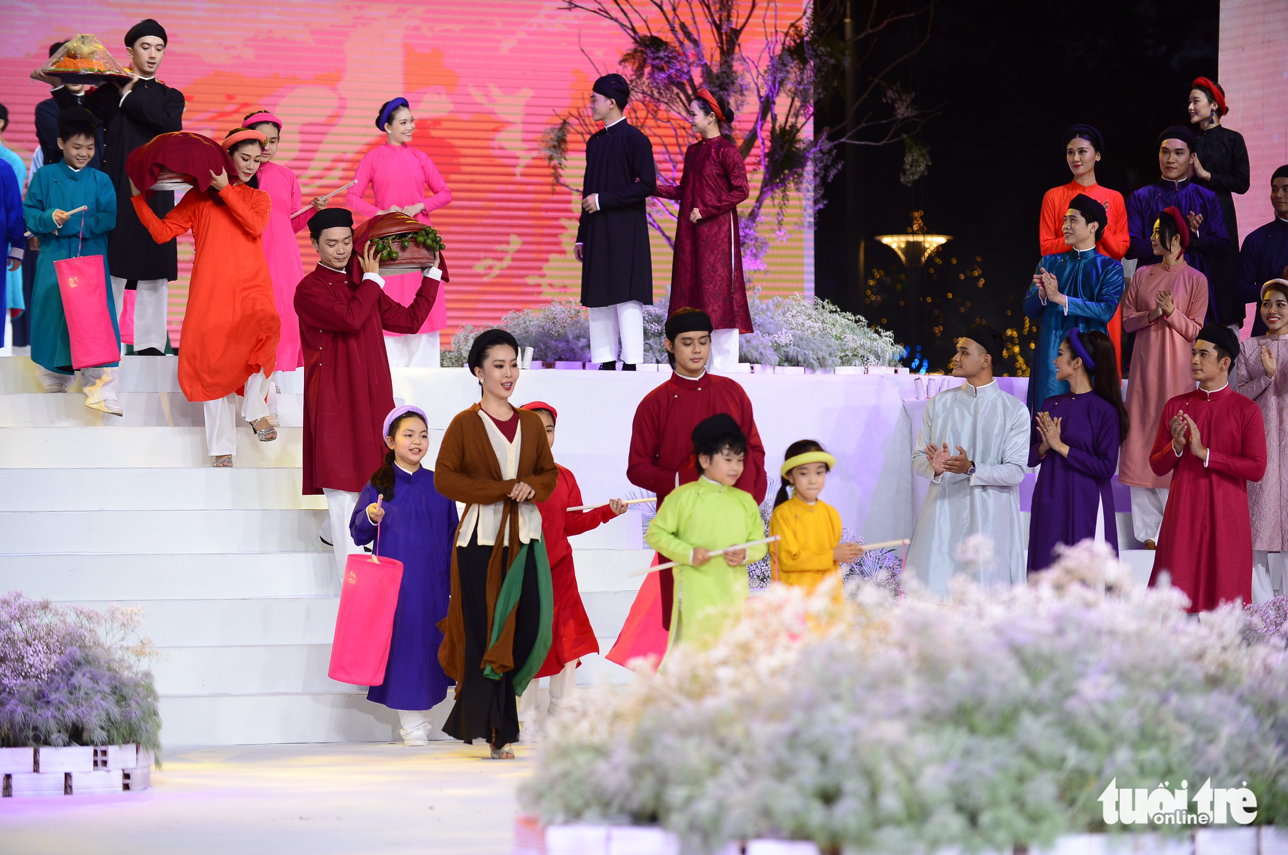 An ao dai collection is performed at the opening ceremony of the Ho Chi Minh City Ao Dai Festival, March 5, 2022. Photo: Quang Dinh / Tuoi Tre