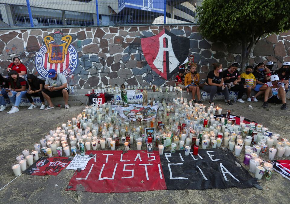 Fans of soccer team Atlas gather after violent clashes broke out between fans of Atlas and Queretaro, during a match at the La Corregidora stadium in Queretaro, that left two dozen people hospitalized, in Guadalajara, Mexico March 6, 2022. Photo: Reuters