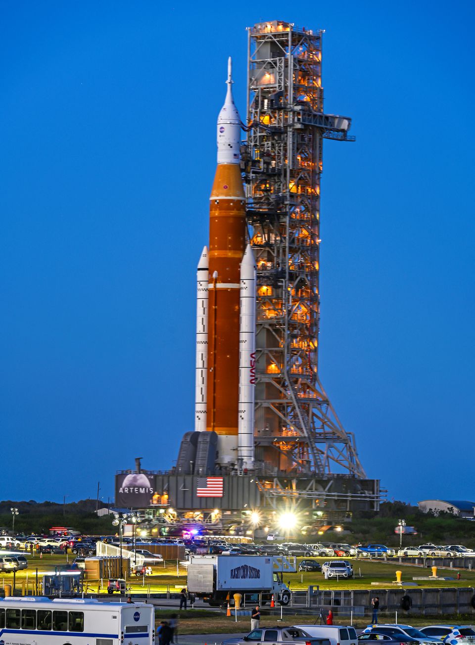 NASA's next-generation moon rocket, the Space Launch System (SLS) rocket with its Orion crew capsule perched on top, rolls down the crawler path from the Vehicle Assembly Building (VAB) on a slow-motion journey to its launch pad at Cape Canaveral, Florida, U.S. March 17, 2022. Photo: Reuters