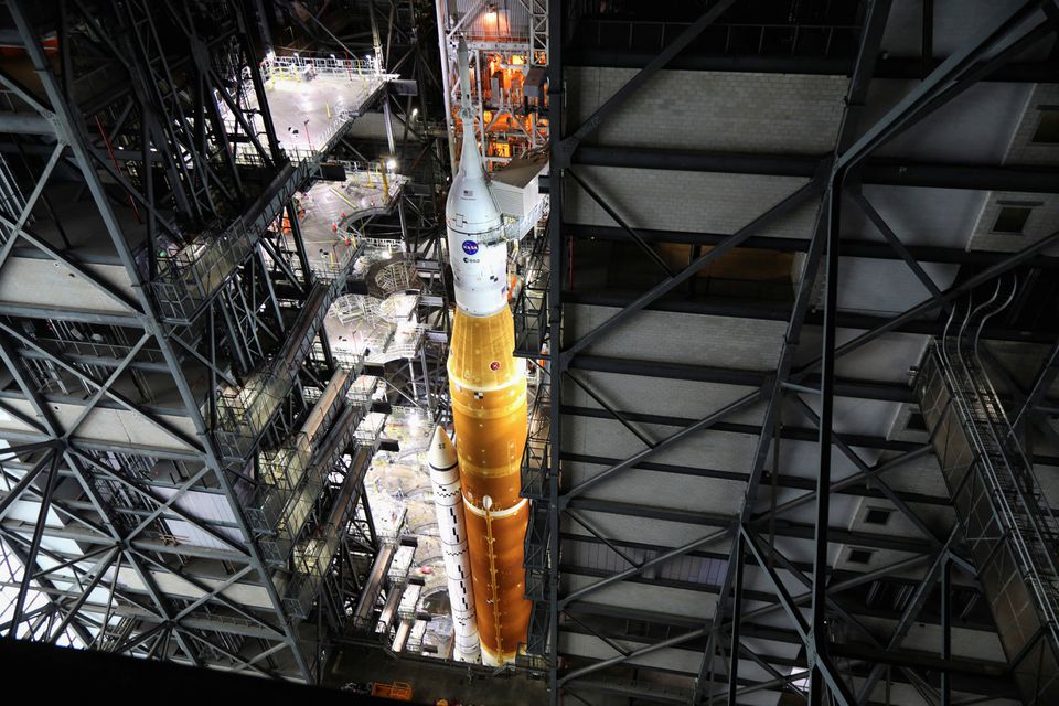 NASA's next-generation moon rocket, the Space Launch System (SLS) rocket with its Orion crew capsule perched on top, is seen in the Vehicle Assembly Building (VAB) before it is scheduled to make a slow-motion journey to its launch pad at Cape Canaveral, Florida, U.S. March 16, 2022. Photo: Reuters