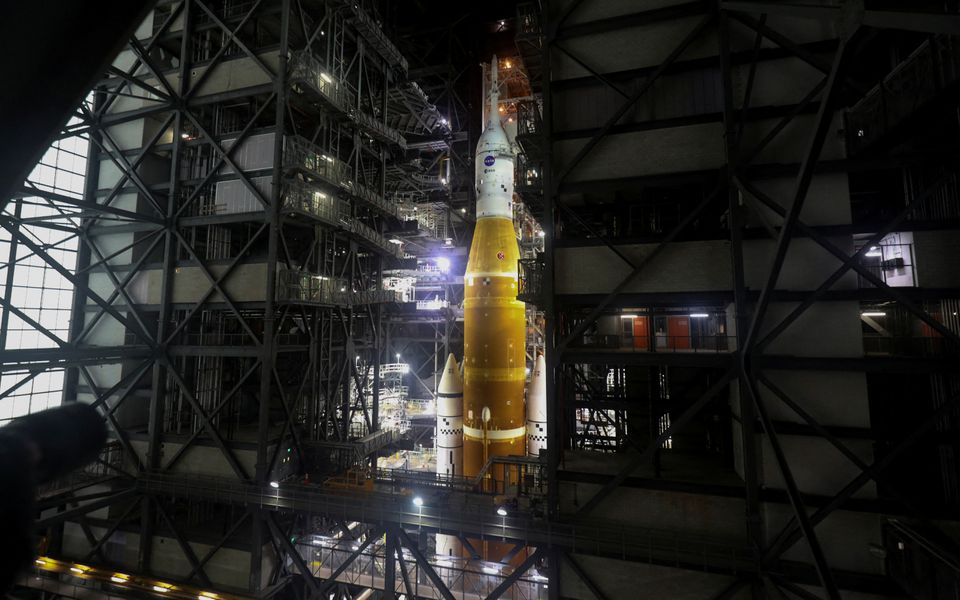 NASA's next-generation moon rocket, the Space Launch System (SLS) rocket with its Orion crew capsule perched on top, is seen in the Vehicle Assembly Building (VAB) before it is scheduled to make a slow-motion journey to its launch pad at Cape Canaveral, Florida, U.S. March 16, 2022. Photo: Reuters