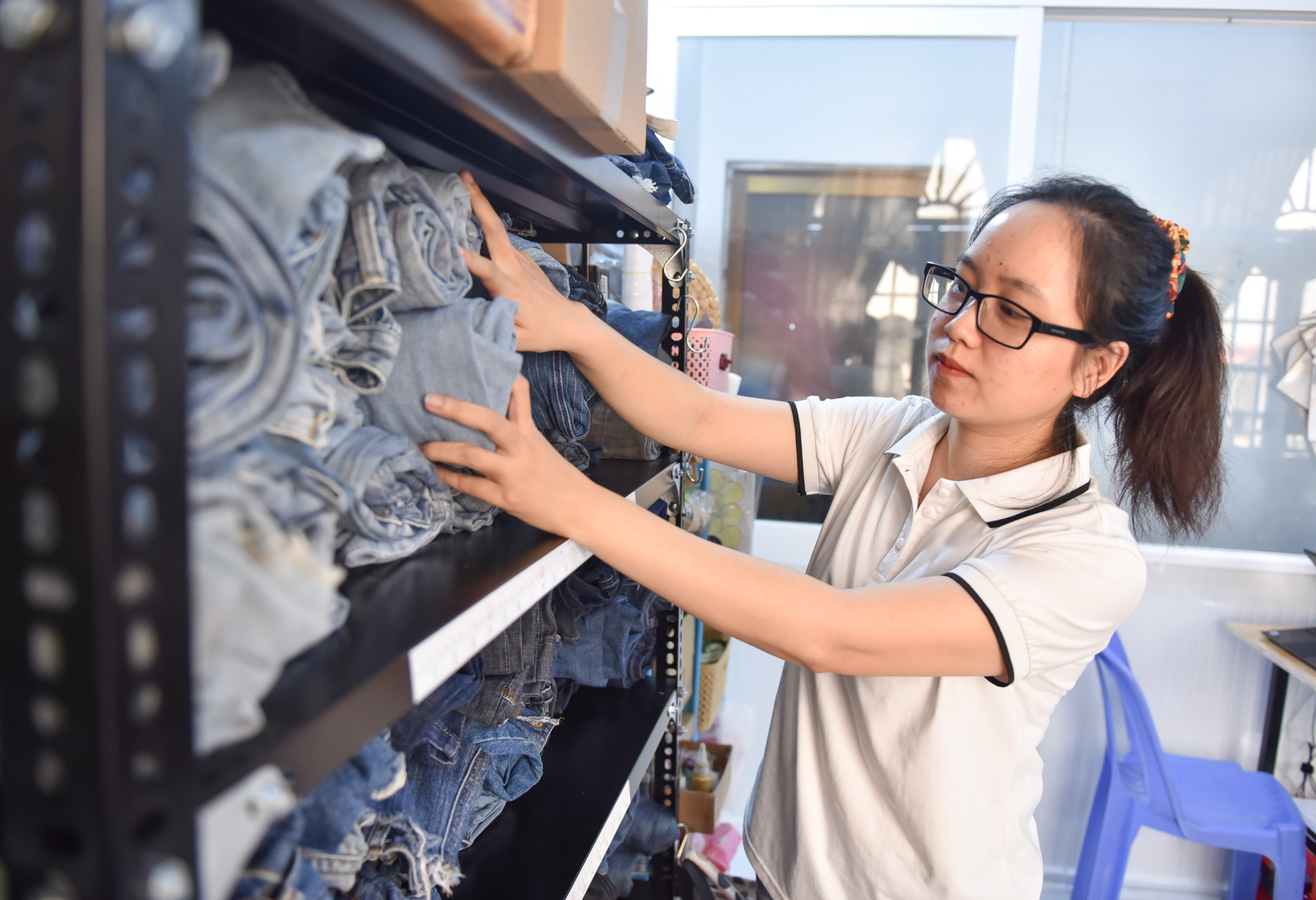 Old denim items are seen at Tham’s shop in Tan Binh District, Ho Chi Minh City. Photo: Ngoc Phuong / Tuoi Tre News