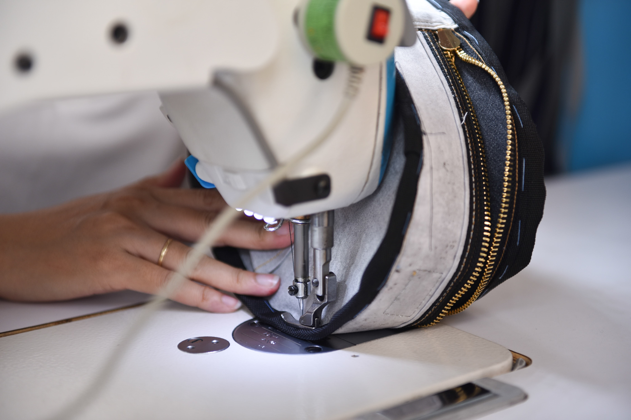 Tham sews a bag at her shop in Tan Binh District, Ho Chi Minh City. Photo: Ngoc Phuong / Tuoi Tre News