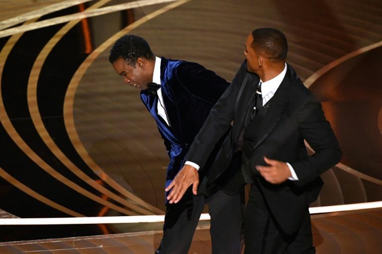 Comedian Chris Rock (L) opted not to press charges after Will Smith (R) slapped him at the Oscars. Photo: AFP