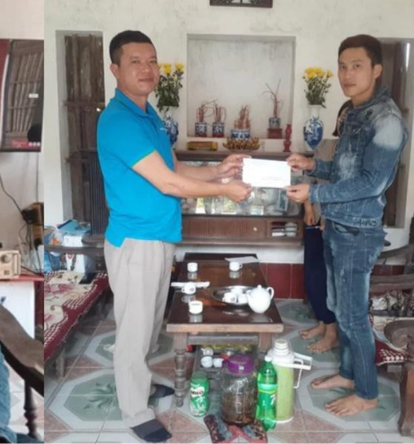 This supplied photo shows Nguyen Van Chinh (right) receiving a man who visited Chinh at home after viewing the video clip of Chinh’s life-saving act on social media on April 10, 2022.