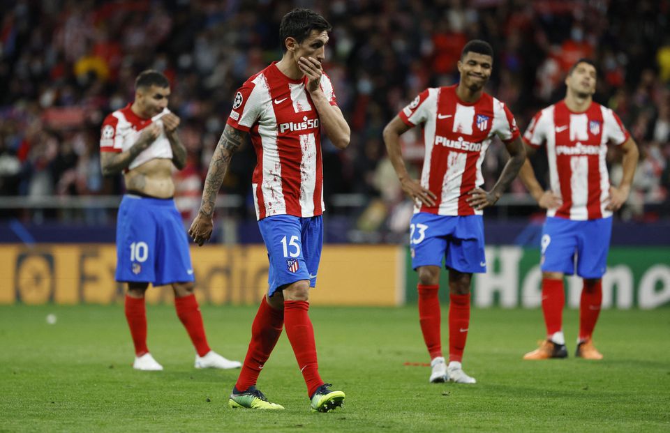 Soccer Football - Champions League - Quarter Final - Second Leg - Atletico Madrid v Manchester City - Wanda Metropolitano, Madrid, Spain - April 13, 2022 Atletico Madrid's Stefan Savic looks dejected after the match with teammates. Photo: Reuters