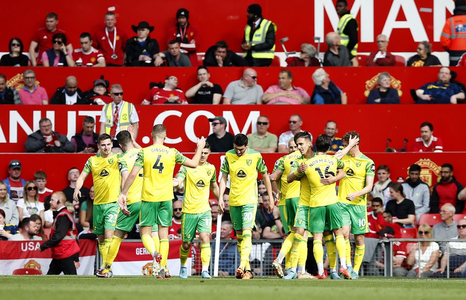 Soccer Football - Premier League - Manchester United v Norwich City - Old Trafford, Manchester, Britain - April 16, 2022 Norwich City's Teemu Pukki celebrates scoring their second goal with teammates. Photo: Reuters
