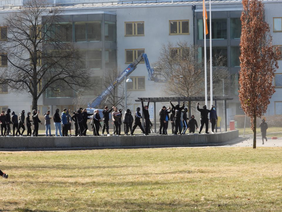 People walk during a riot ahead of a demonstration planned by Danish anti-Muslim politician Rasmus Paludan and his Stram Kurs party, which was to include a burning of the Muslim holy book Koran, in Navestad, Norrkoping, Sweden April 17, 2022, in this handout image obtained by Reuters on April 17, 2022. Ulf Wigh/Wighsnews/Handout via Reuters