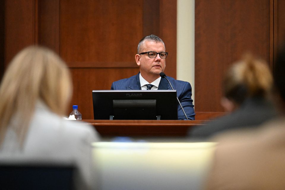 Sean Bett, a security guard for actor Johnny Depp, testifies during a hearing at the Fairfax County Circuit Courthouse as Depp's defamation case against ex-wife Amber Heard continues, in Fairfax, Virginia, U.S., April 19, 2022. Jim Watson/Pool via Reuters