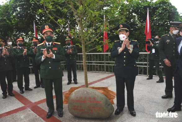 The defense ministers of China and Vietnam are seen at a friendship tree planting ritual at Shuikou International Border Gate in China’s Guangxi Province in this photo on April 23, 2022. Photo: Nguyen Bao / Tuoi Tre