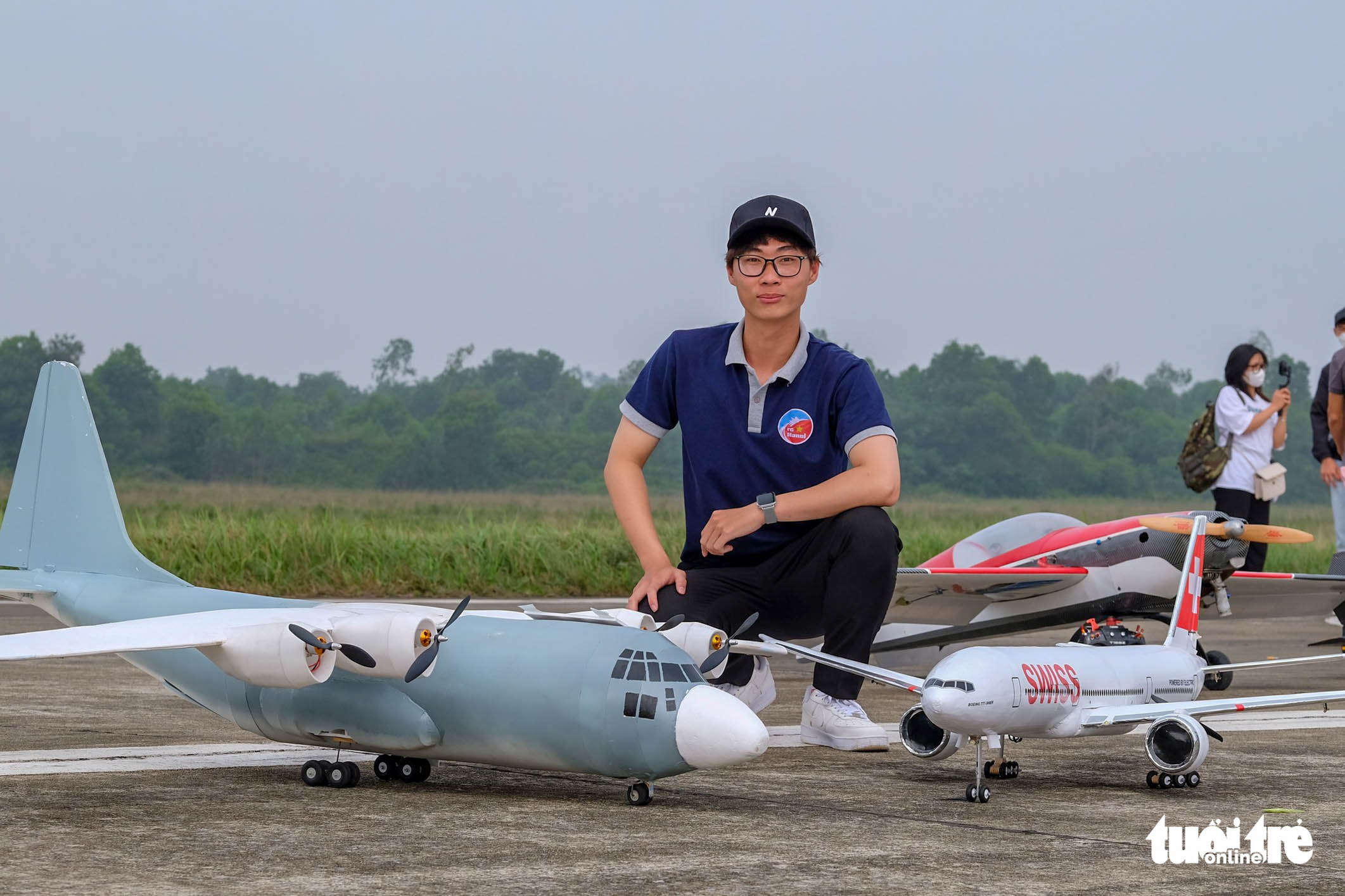 Vo Hoang Hieu, 20, poses with his model plane at the Funfly 2022 competition in Hanoi, April 23, 2022. Photo: Ha Quan / Tuoi Tre