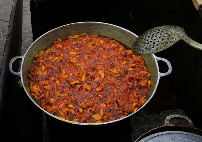 Plantains fried in a crude palm oil, are seen on the stand of a street vendor in Abidjan. Photo: Reuters