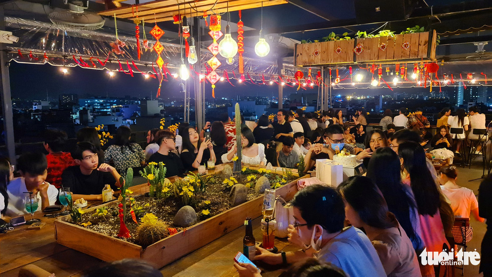 Visitors crowd a rooftop bar in Ho Chi Minh City, Vietnam. Photo: Vu Thuy / Tuoi Tre