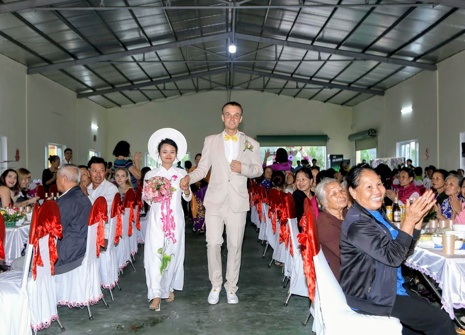 Estonian Meigo Mark and his wife Nguyen Thi Sam greet guests at their wedding in Thai Binh Province, Vietnam in October, 2018. Photo by courtesy by Meigo Mark