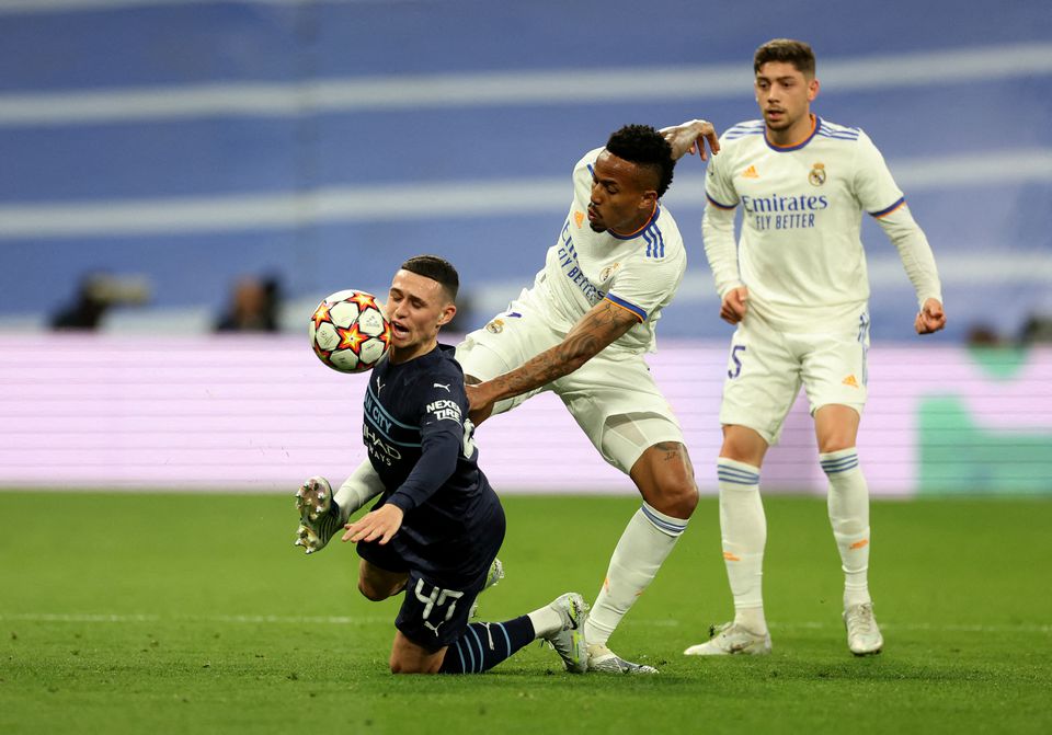 Soccer Football - Champions League - Semi Final - Second Leg - Real Madrid v Manchester City - Santiago Bernabeu, Madrid, Spain - May 4, 2022 Manchester City's Phil Foden in action with Real Madrid's Eder Militao. Action Images via Reuters