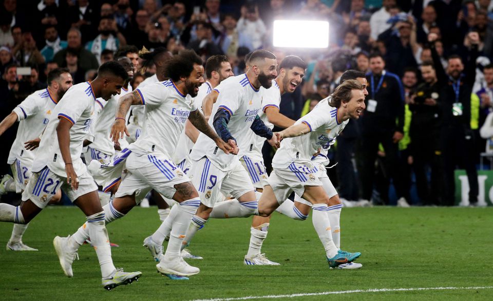 Soccer Football - Champions League - Semi Final - Second Leg - Real Madrid v Manchester City - Santiago Bernabeu, Madrid, Spain - May 4, 2022 Real Madrid's Luka Modric, Karim Benzema and teammates celebrate after the match. Photo: Reuters