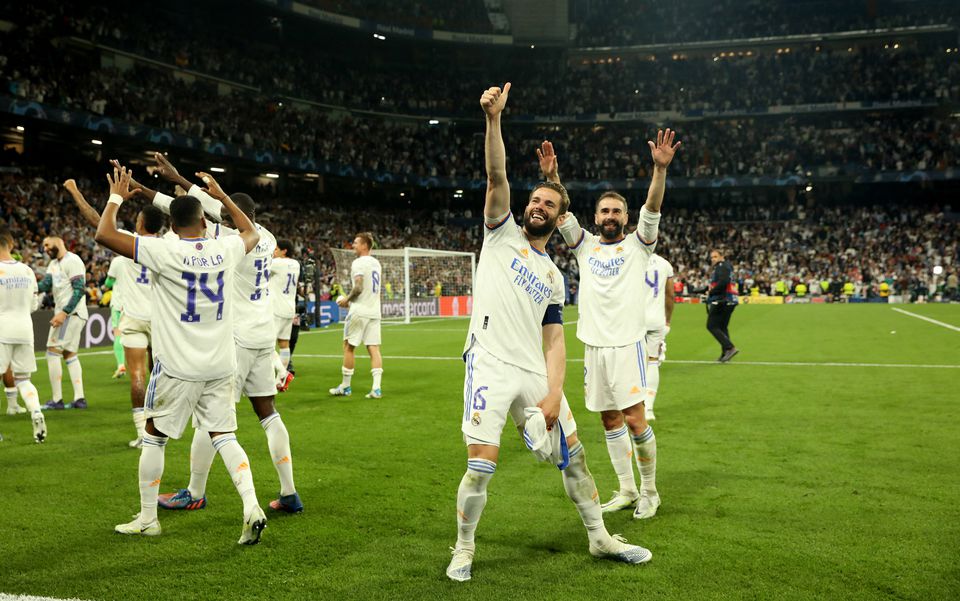 Soccer Football - Champions League - Semi Final - Second Leg - Real Madrid v Manchester City - Santiago Bernabeu, Madrid, Spain - May 4, 2022 Real Madrid's Nacho celebrates after the match with teammates. Photo: Reuters