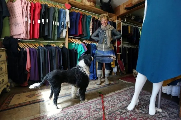 Adorit owner Emma Inns says her three dogs, including Oscar, bring in customers to her boutique Photo: AFP