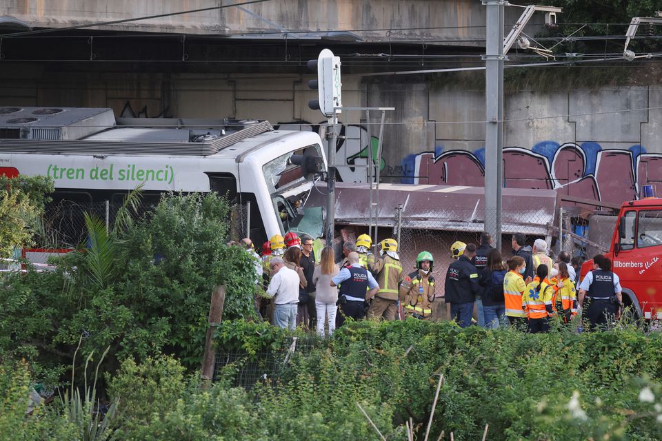 Spanish first responders attend to the scene, after a commuter train and a goods train collided, on the outskirts of Barcelona, Spain May 16, 2022. Photo: Reuters
