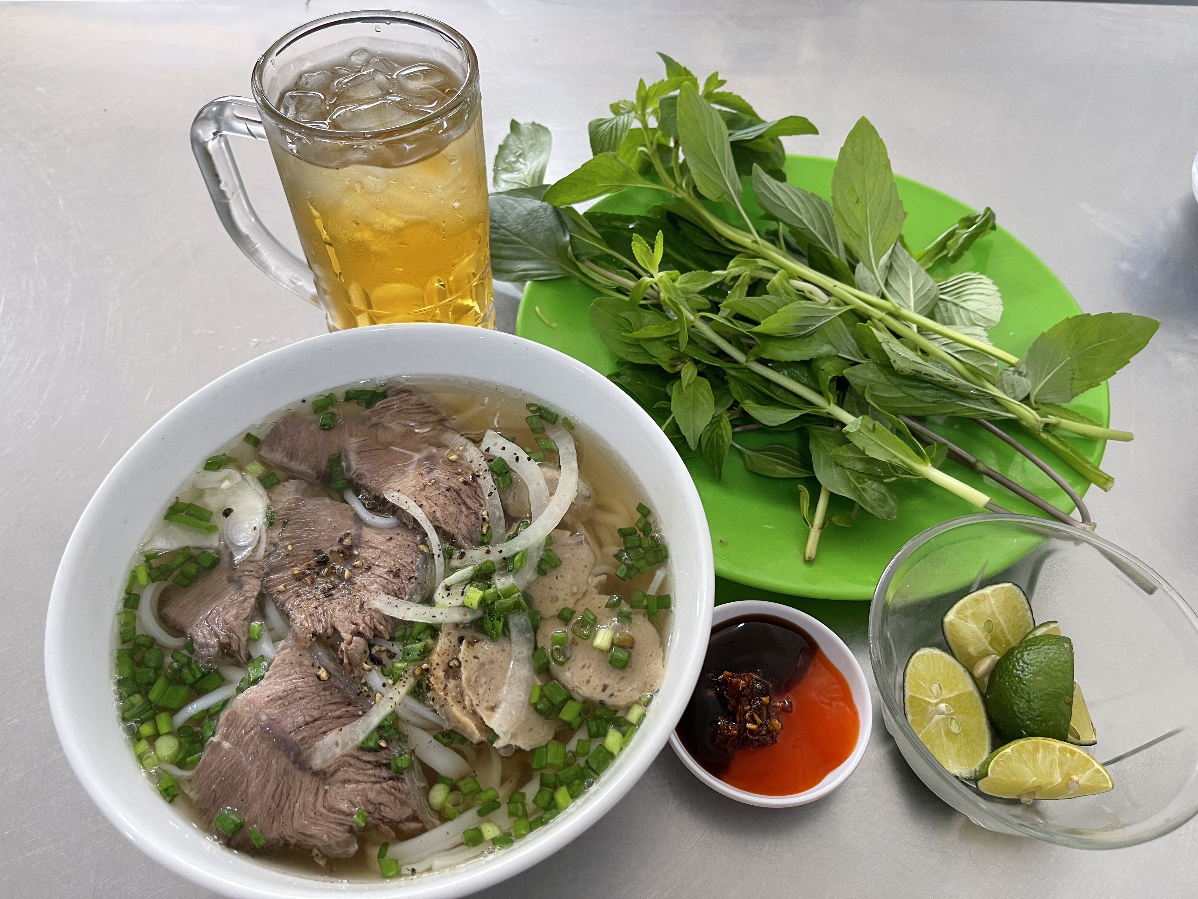 A bowl of pho is ready to serve at a 'quán' in District 12, Ho Chi Minh City. Photo: Dong Nguyen / Tuoi Tre News