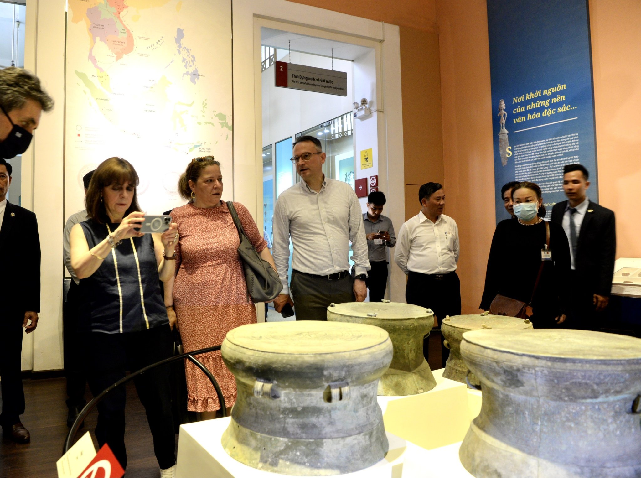 Greek President Katerina Sakellaropoulou takes a photo of the bronze drums at the Museum of Vietnamese History in Ho Chi Minh City, May 19, 2022. Photo: T.T.D. / Tuoi Tre