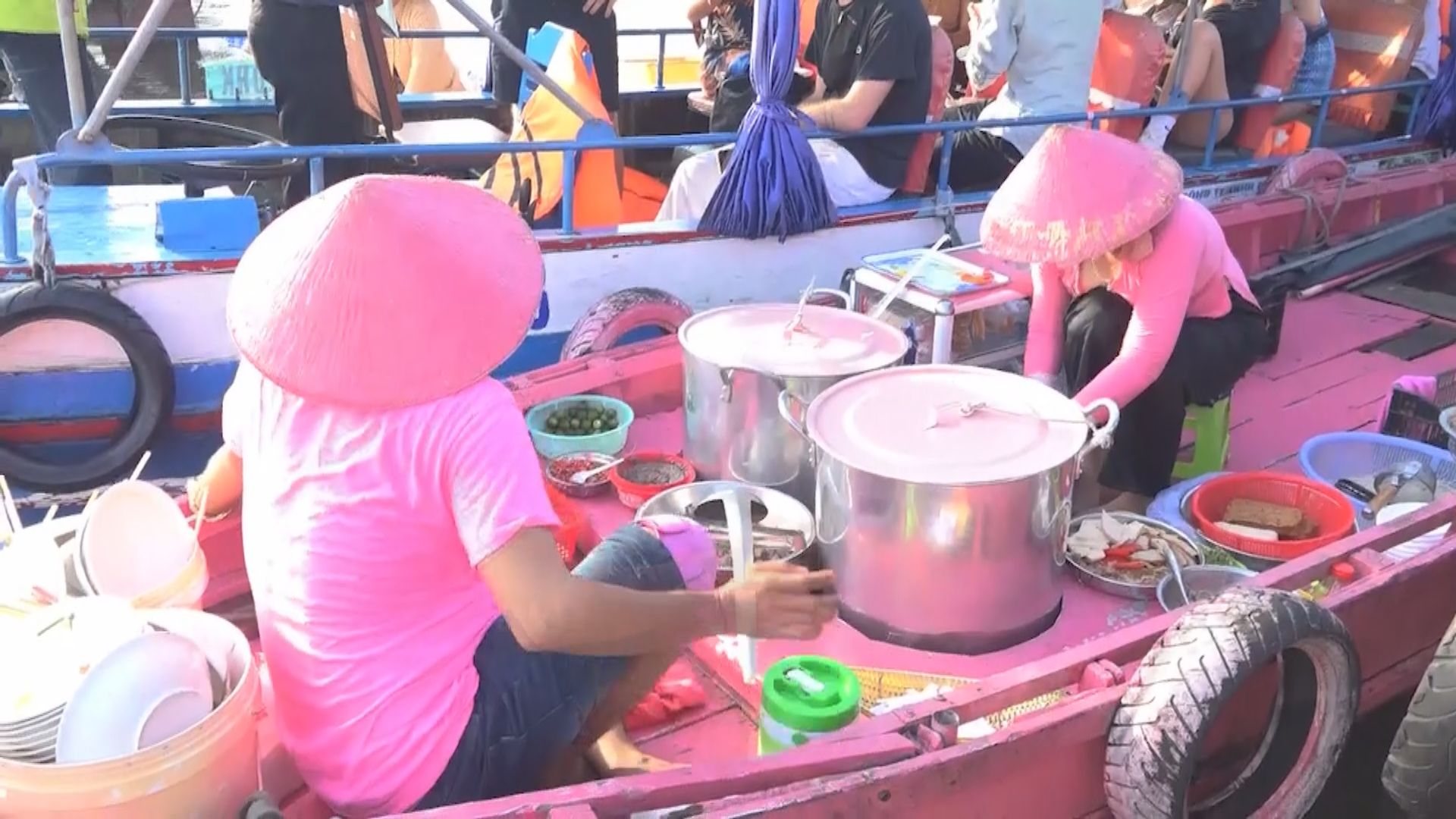 Pink boat adds pop of color to famous floating market in Vietnam