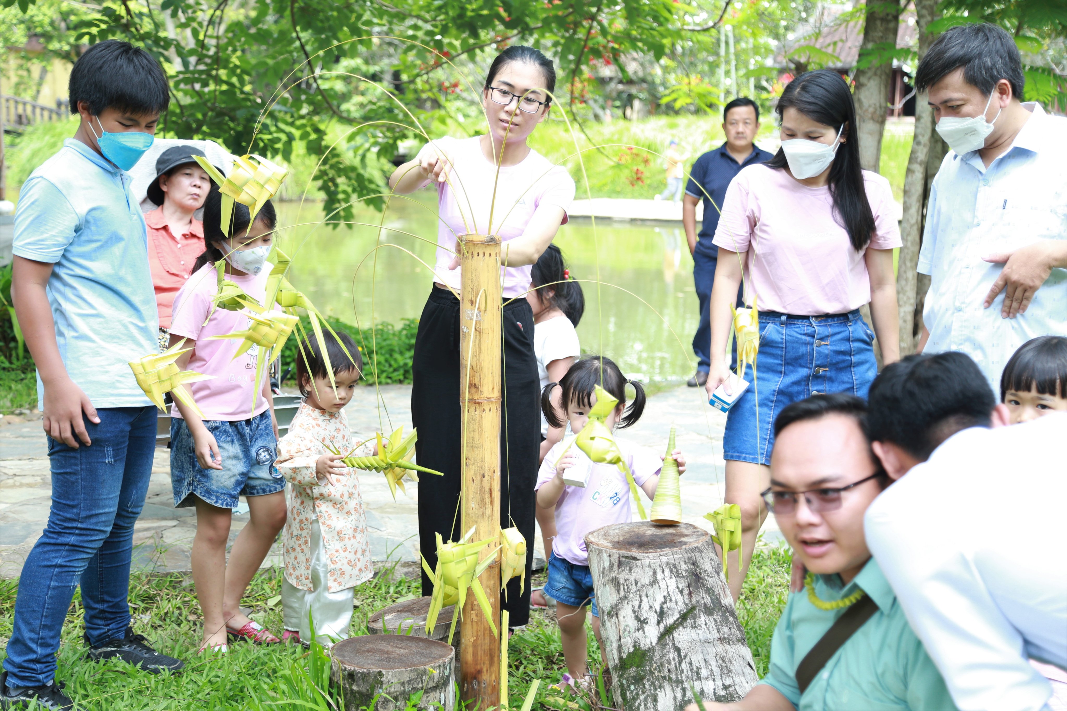 Participants try making toys from leaves at the ‘Leaves Festival’ at Ao Dai Museum in Thu Duc City under Ho Chi Minh City, May 29, 2022. Photo: Handout via Tuoi Tre