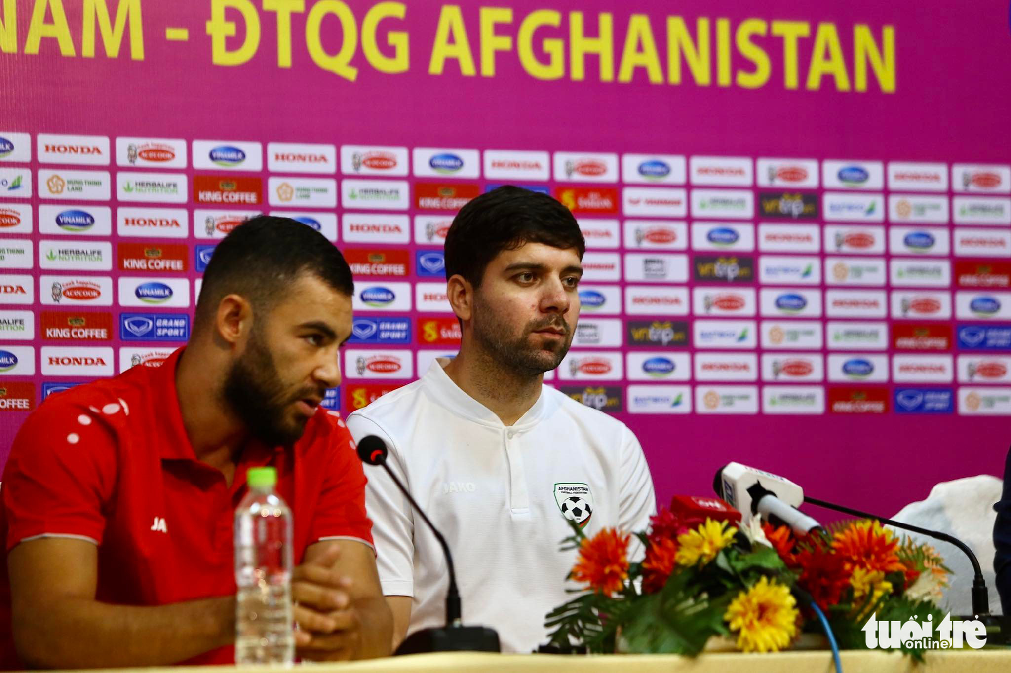 Afghanistan head coach Anoush Dastgir (R) is pictured at a press conference before the friendly between Vietnam and Afghanistan on May 31, 2022. Photo: Hoang Tung / Tuoi Tre