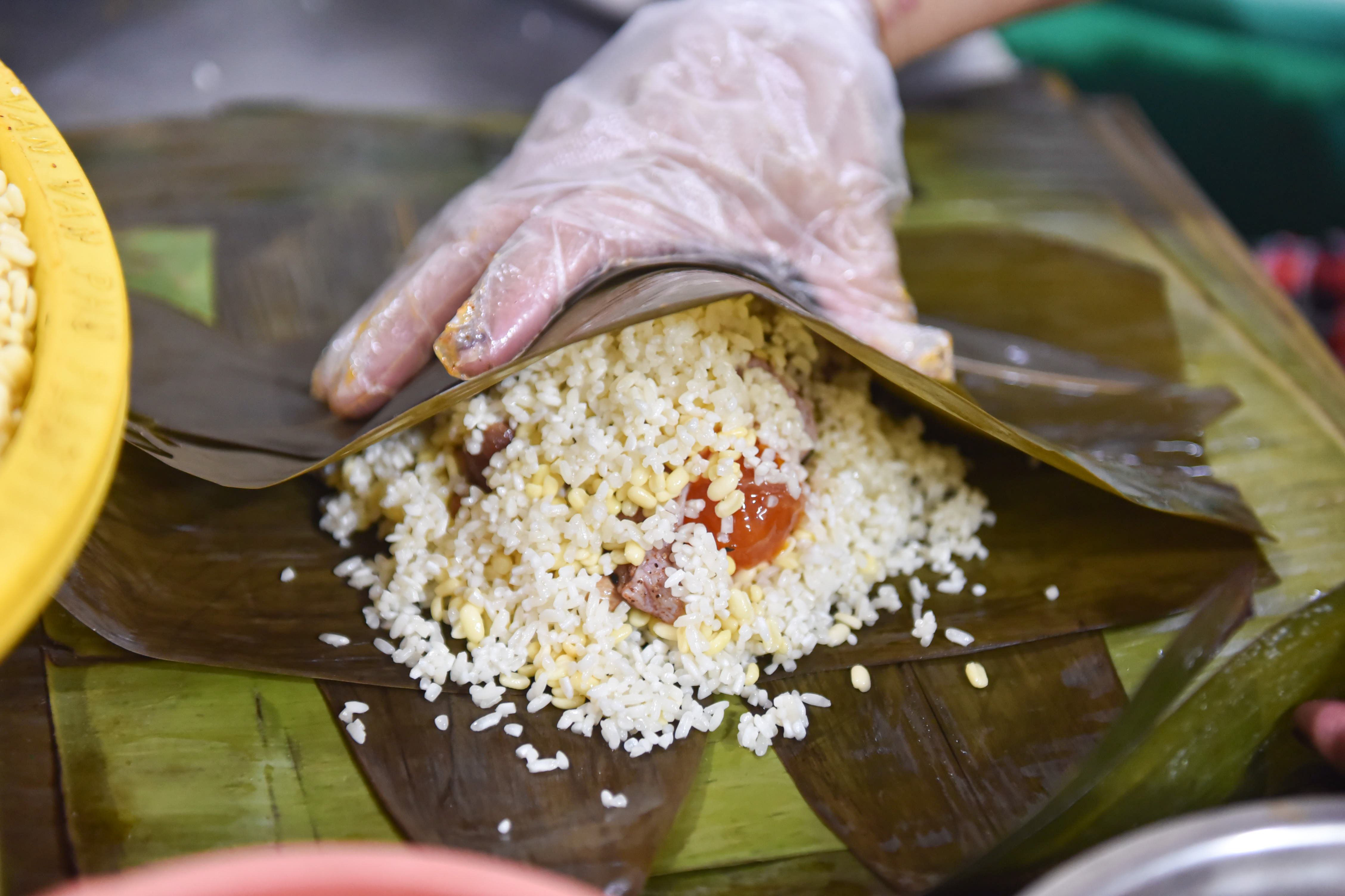 Zongzi being made at An Ky Banh Chung in District 11, Ho Chi Minh City. Photo: Ngoc Phuong / Tuoi Tre