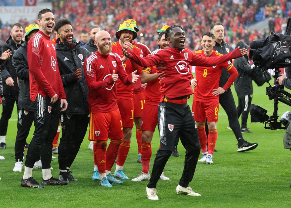 Soccer Football - FIFA World Cup - UEFA Qualifiers - Final - Wales v Ukraine - Cardiff City Stadium, Cardiff, Wales, Britain - June 5, 2022 Wales' Rabbi Matondo celebrates with teammates after qualifying for the World Cup. Action Images via Reuters