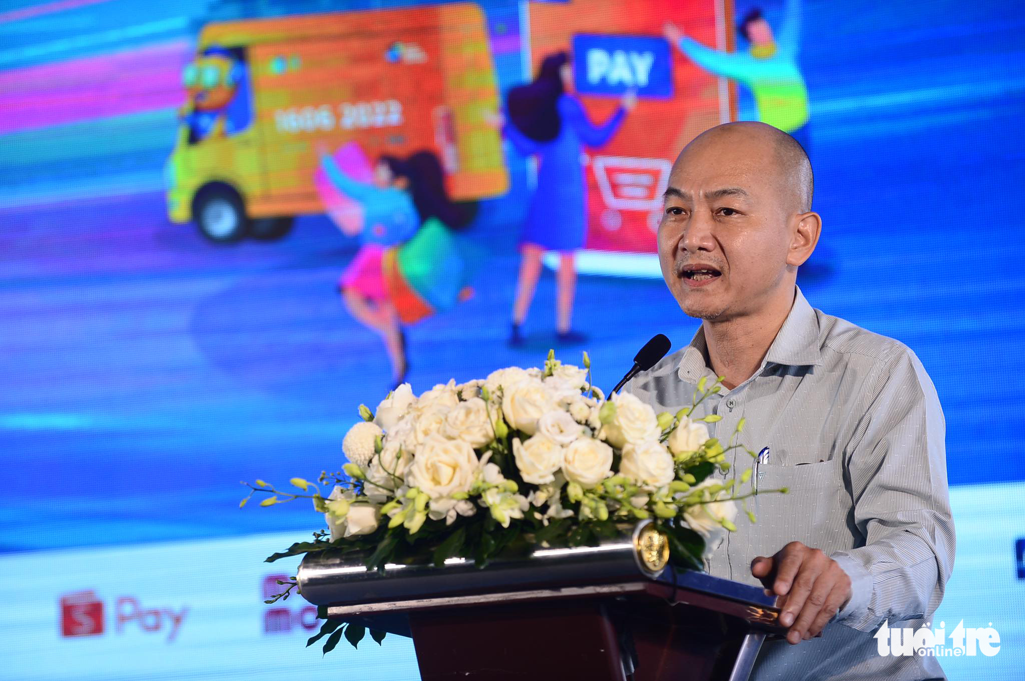 Nguyen Nguyen Phuong, deputy director of the Ho Chi Minh City Department of Industry and Trade, speaks at the Cashless Fair in Thu Duc City, Ho Chi Minh City, June 12, 2022. Photo: Quang Dinh / Tuoi Tre