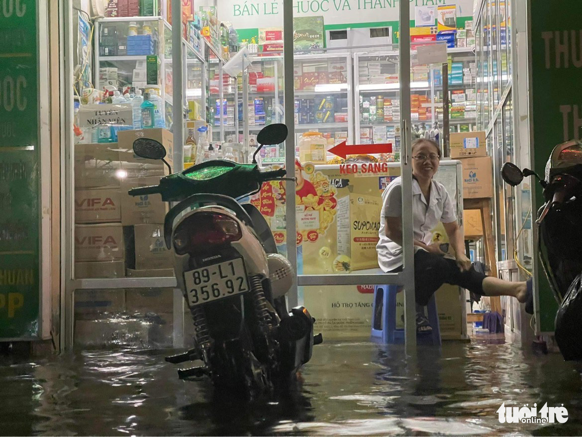 A pharmacy is inundated in Hanoi, June 13, 2022. Photo: Tuoi Tre