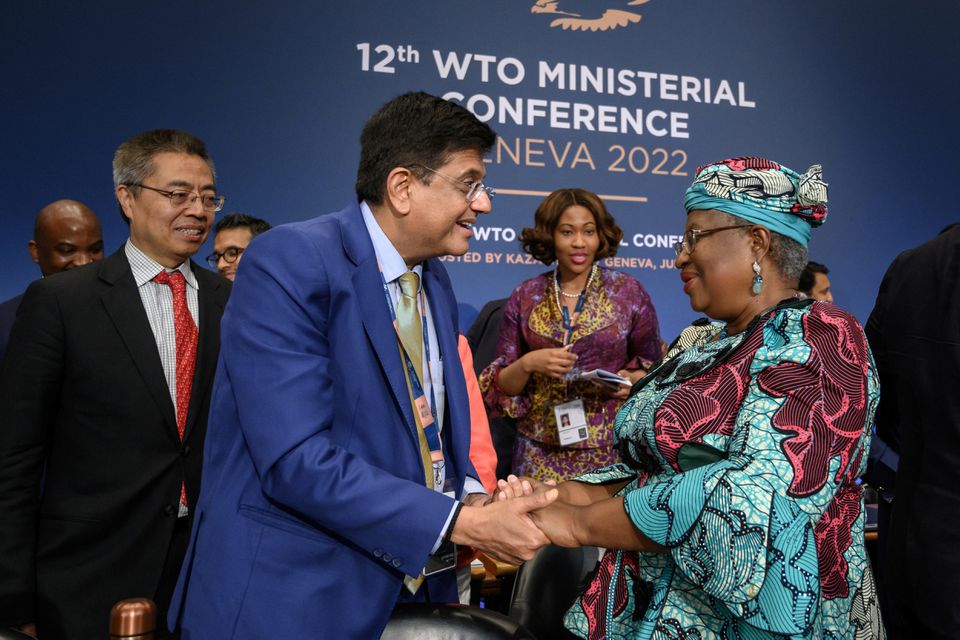 World Trade Organization Director-General Ngozi Okonjo-Iweala is congratulated by Indian Minister of Commerce Piyush Goyal after a closing session of a World Trade Organization Ministerial Conference at the WTO headquarters in Geneva, Switzerland June 17, 2022. Fabrice Coffrini/Pool via Reuters