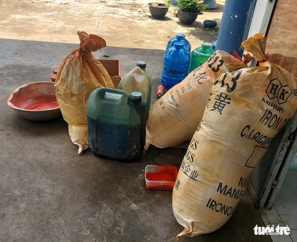 Chemicals used in the production of fake gasoline are confiscated by police in Ba Ria-Vung Tau Province, Vietnam. Photo: Quan Truong / Tuoi Tre