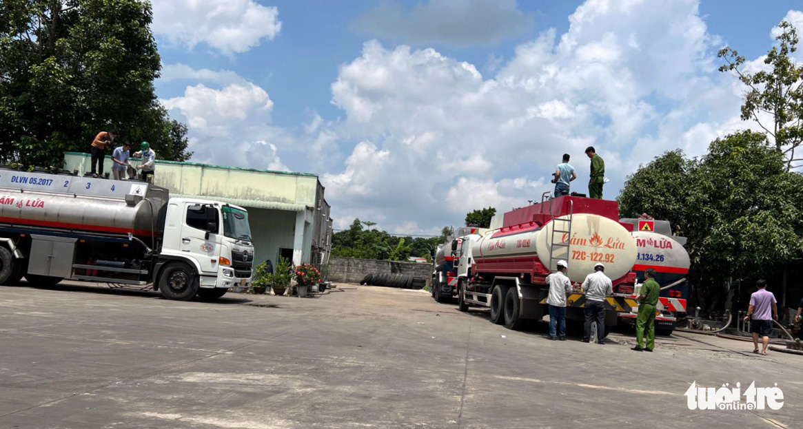 Police inspect fuel trucks at the Gia Khiem Vung Tau petroleum retail store in Ba Ria-Vung Tau Province, Vietnam. Photo: Quan Truong / Tuoi Tre