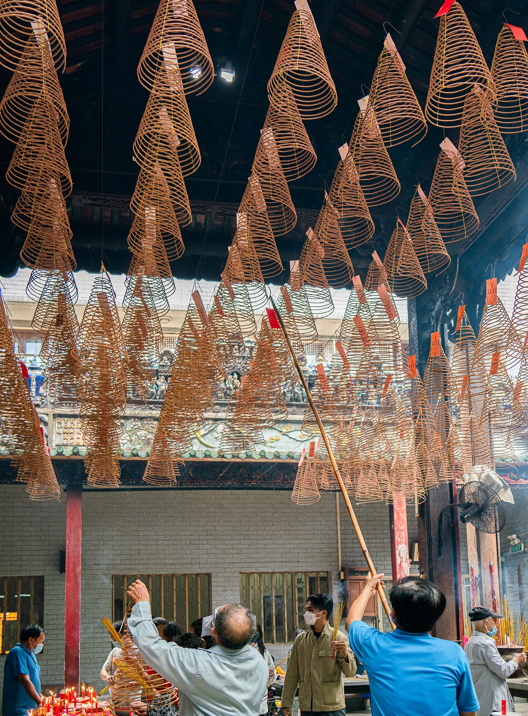 Conical incense coils are also attached with red tags where wishes of visitors are written. Photo: Nguyen Trung Au / Tuoi Tre News
