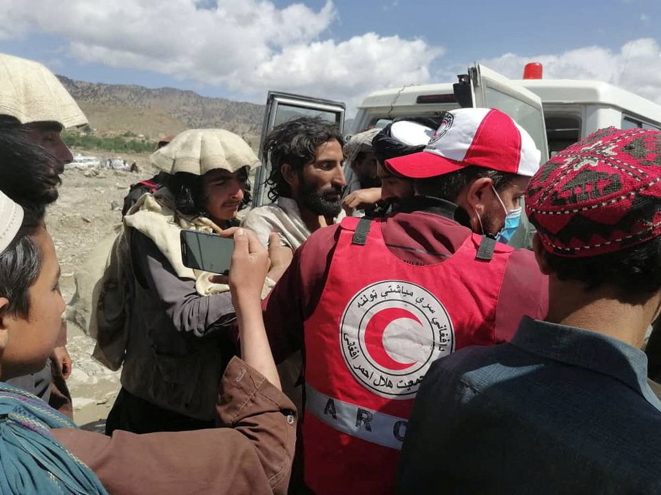 Afghan Red Crescent medics and volunteers transport earthquake victims to hospitals in Spera district, Khost province, Afghanistan, June 22, 2022. Photo: Afghan Red Crescent Society/Handout via REUTERS