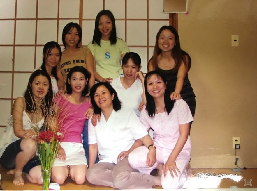 Minh Nguyet (second from right) in a photo with Vietnamese female trainees who worked in electronics assembly in Japan in 2007 in a photo provided.