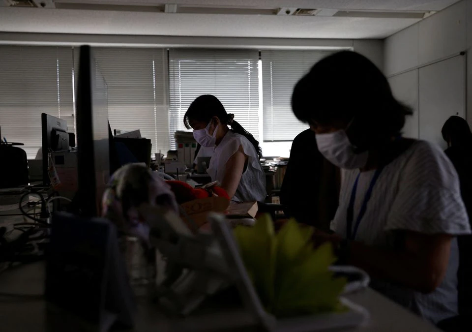 The interior of Ministry of Economy, Trade and Industry (METI) building is dimly lit to save electricity during daytime as Japanese government issues warning over possible power crunch in Tokyo, Japan June 27, 2022. Photo: Reuters