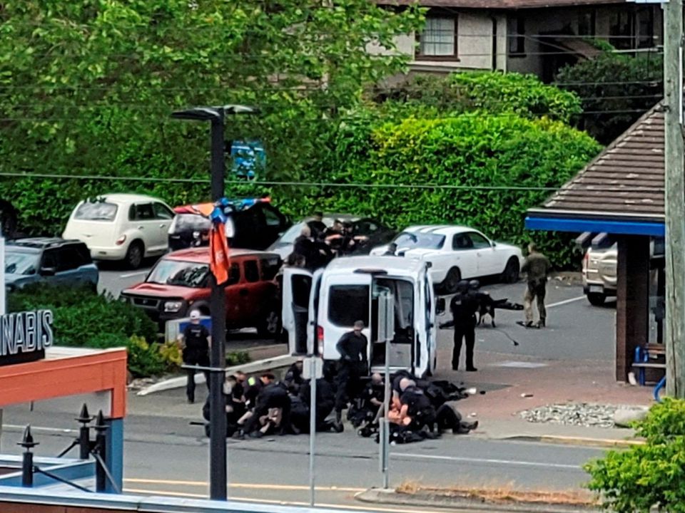 General view of the site where two armed suspects died and six police officers were shot, during an incident at a bank in Saanich, British Columbia, Canada June 28, 2022 in this picture obtained from social media. Photo: Joan B Flood/via Reuters
